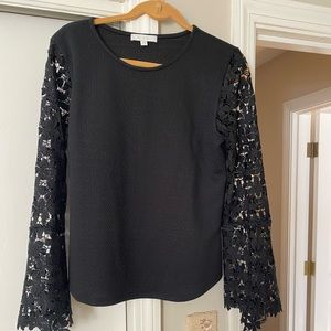 Great dress up or down top. Hirgeous lace sleeves. Jeans or pants works eell